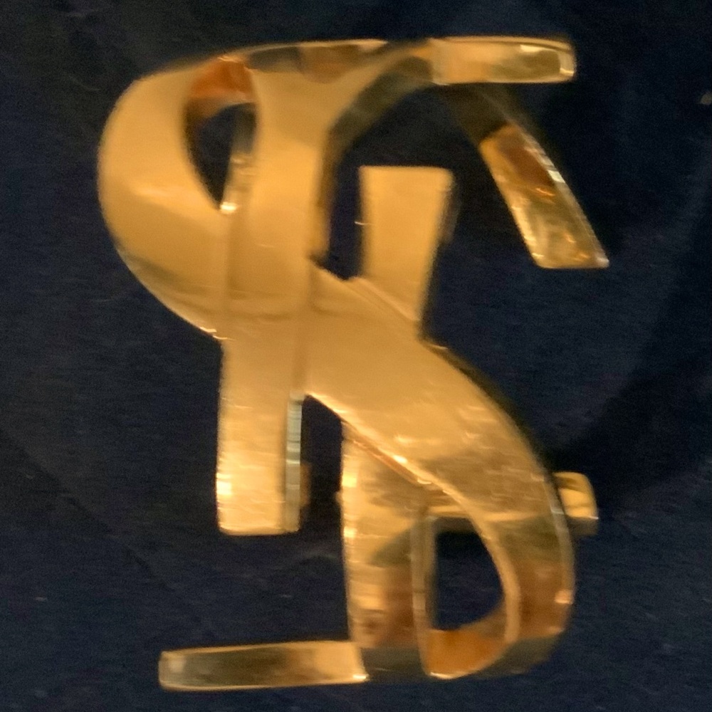YSL cuff in Gold.